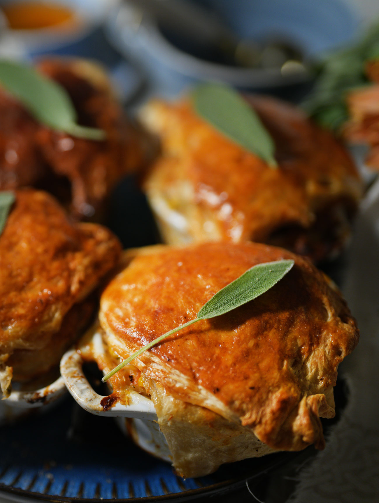 Small classic chicken pot pies baked in cocottes with a golden, flaky crust.