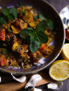 A vibrant bowl of Coconut Mango Chicken Curry with fresh herbs and rice