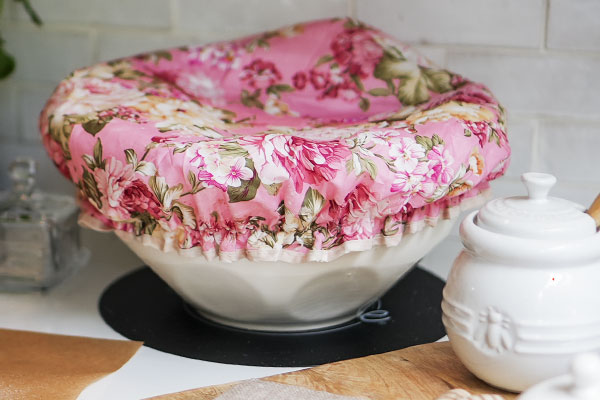 Resting Sourdough Dough – Fermenting with a colorful shower cap waiting patiently for the Perfect Rise