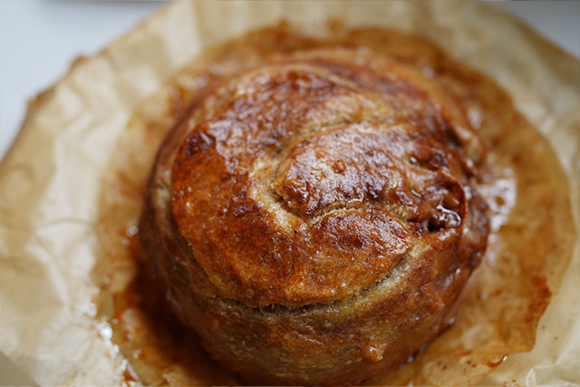 Afterglow swirls cinnamon sourdough bread with brown sugar s an early attempt at cinnamon swirl sourdough bread this round loaf shows signs of a baking fail under risen a bit collapsed and still full of heart proof that every great recipe starts with a flop or two sourdough afterglow Round cinnamon swirl sourdough loaf with a collapsed shape and underbaked texture — a baking fail that led to the final perfected recipe