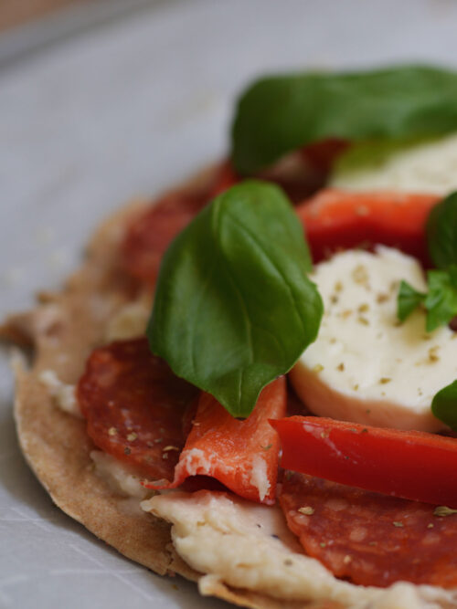 fresh mozzarella, and pepperoni prepared as toppings for sourdough discard skillet pizza.